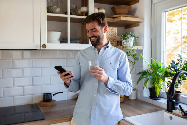 istock Morning phone check and a healthy start with water 2182715880