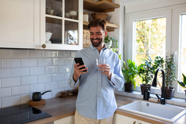 istock Morning phone check and a healthy start with water 2182715970