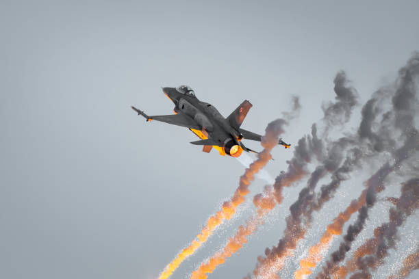 Antidotum Airshow Leszno, F-16 Tiger Demo Team, F-16C Block 52+ plane. In the night show, the pilot presents the fighter's defense system by releasing flares. Leszno, Poland - June, 22, 2024: Antidotum Airshow Leszno, F-16 Tiger Demo Team, F-16C Block 52+ plane. In the night show, the pilot presents the fighter's defense system by releasing flares. f 16 demo team stock pictures, royalty-free photos & images