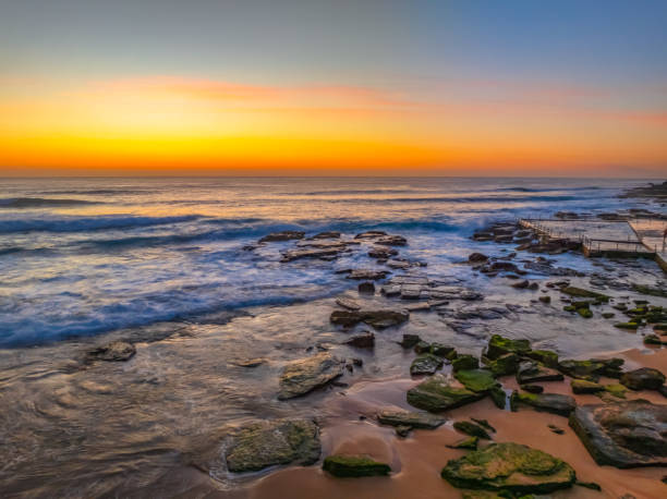 istock Sunrise at the Seaside with an Orange Horizon 2182721187
