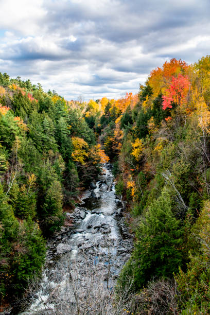 Coaticook, Canada - Oct. 12 2024: Colorful autumn season in Parc de la Gorge