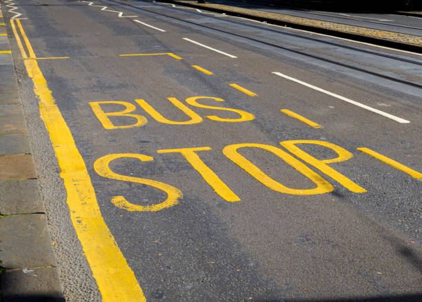 istock A yellow line with the word Bus Stop written in black 2182724287
