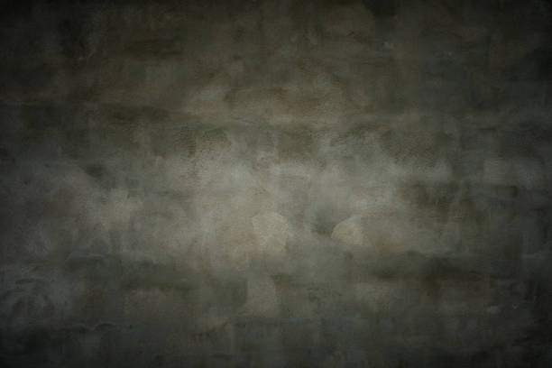 istock dark textured background from wall with grey spotted rough plaster and gradient vignette. artistic moody backdrop or blank for beautiful creative design 2182726527