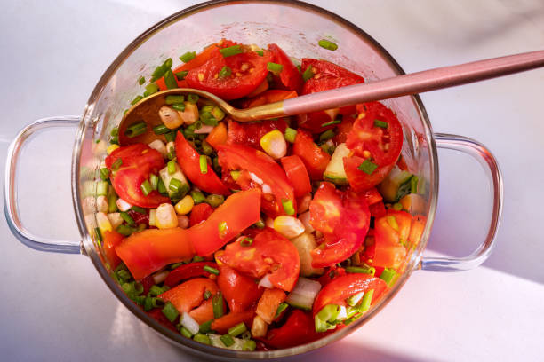 istock Tomato Salad. In glass saucepan. Top view, flat lay 2182727170