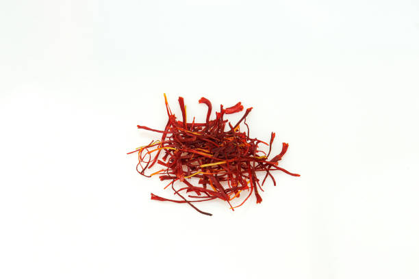 istock Red saffron pile of condiment isolated on white background 2182727359