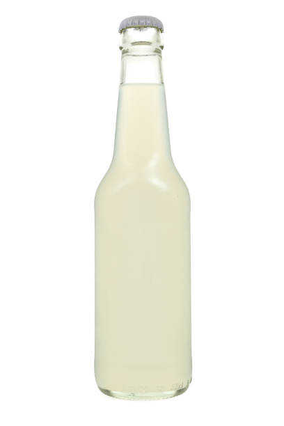 White liquid juice in closed blank glass bottle isolated on white background