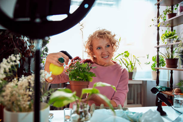 istock Blogger telling online about watering flowers 2182733710