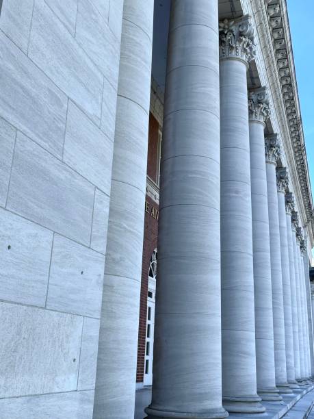 istock Heavy grey stone pillars columns in a row perspective 2182734897
