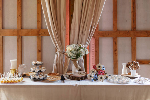 istock Dessert Table With Pies And Floral Centerpiece Setup 2182739953