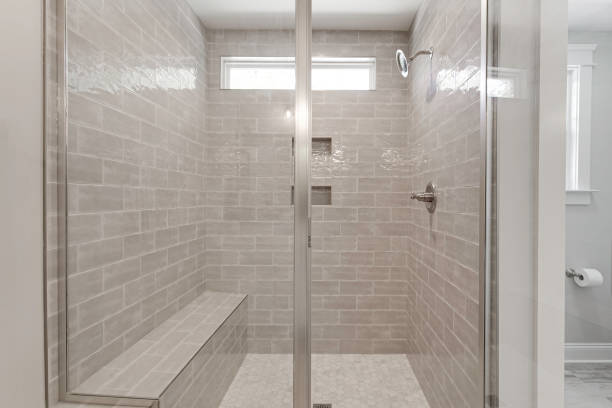 istock Modern Shower Area With Glass Doors And Gray Tiles 2182740136