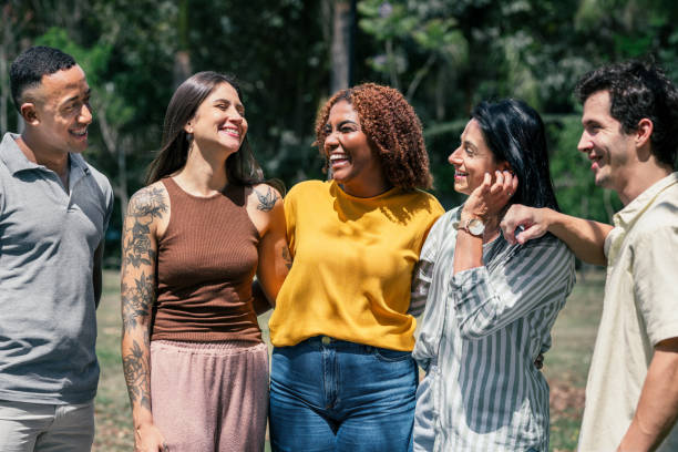 istock Small group of people having conversations outdoors in the sun 2182740766