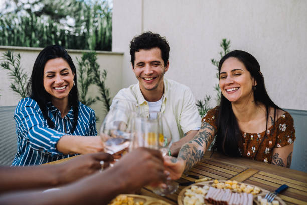 istock Small group of adults toasting in a rooftop 2182740889