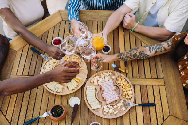 istock Small group of people having a meal together in a rooftop 2182741077