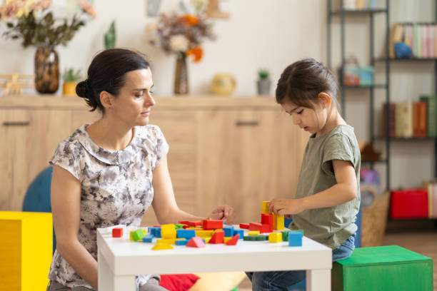 istock Engaged child and attentive woman 2182742744
