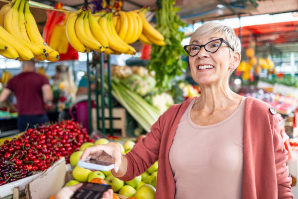 istock Senior lady engaging in a card transaction 2182742813