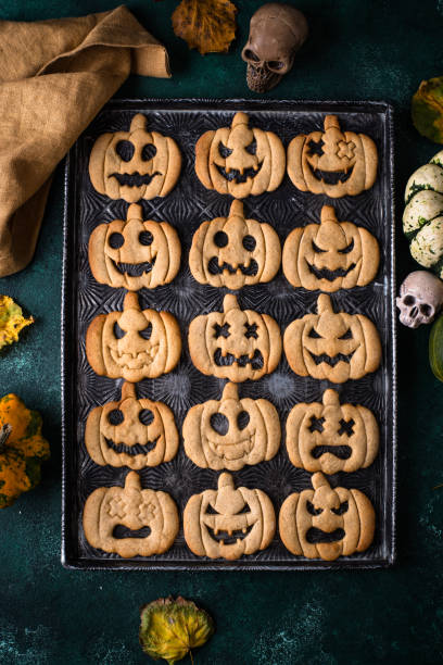 istock Halloween cookies in shape of jack-o-lantern 2182744483