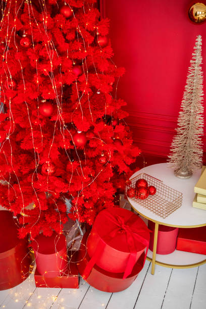 istock Festive red Christmas tree and decorations in a vibrant holiday setting 2182745054