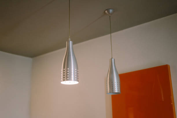 A stylish hanging lamp in a hotel room, showcasing an aesthetic and appealing design