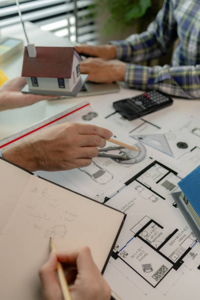 istock A meeting of architects who work hard together to create outstanding work. Engineers and contractors collaborate to solve problems that arise in design and construction. 2182749264