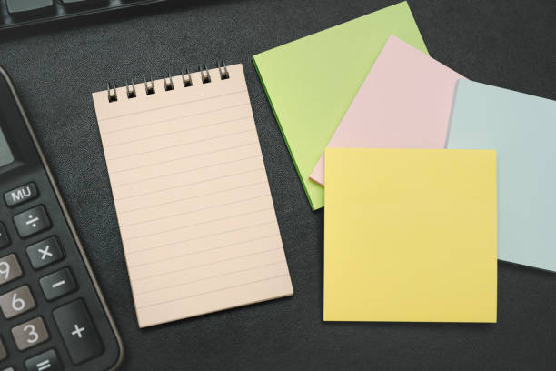 istock notepad on office desk table with keyboard and other supplies. 2182754589