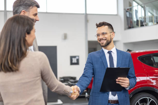 istock Salesman shaking hands with smiling woman 2182757454
