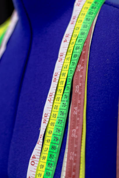 istock Colorful Measuring Tapes Arranged on a Blue Mannequin, Essential Tools for Tailoring and Fashion Design, Capturing Precision and Creativity 2182761305