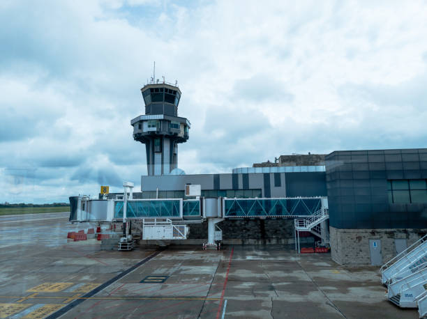 istock Control Tower and Jet Bridge at Barranquilla Airport on a Cloudy Day 2182761589