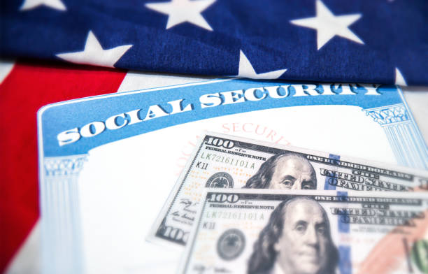 istock Social Security card is placed on the American flag, background. Social Security for old age people in USA concept backdrop 2182762335