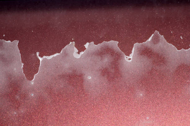 istock Red surface with peeling paint close-up textured background abstract 2182762499