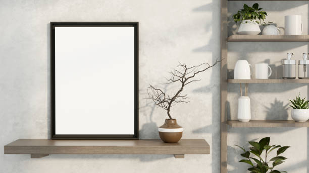 istock A minimalist black picture frame mockup is displayed on a wall shelf in simple white room. 2182769139