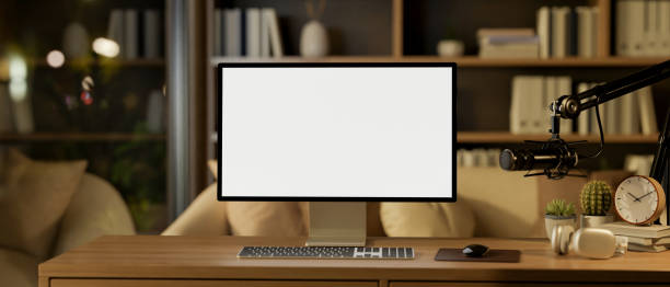 istock A contemporary home podcast office at night features a computer with a white screen mockup. 2182769198