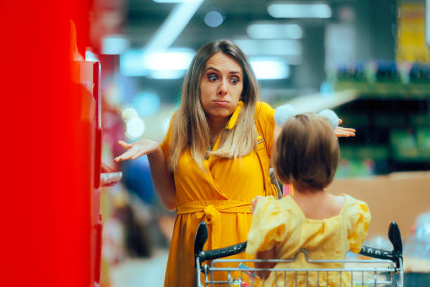 istock Broke Mom Explaining to her daughter about Frugality 2182773056
