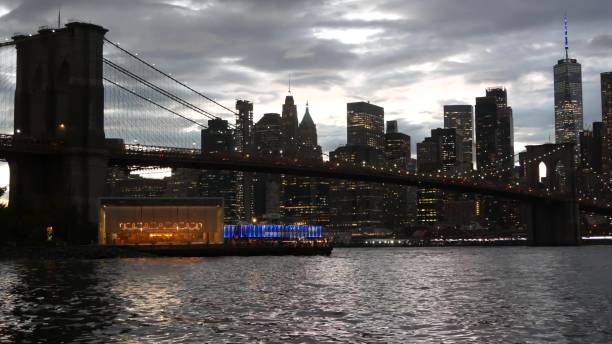 istock Brooklyn Bridge, Dumbo carousel. New York City Manhattan downtown skyline. Dramatic twilight dusk. 2182776421