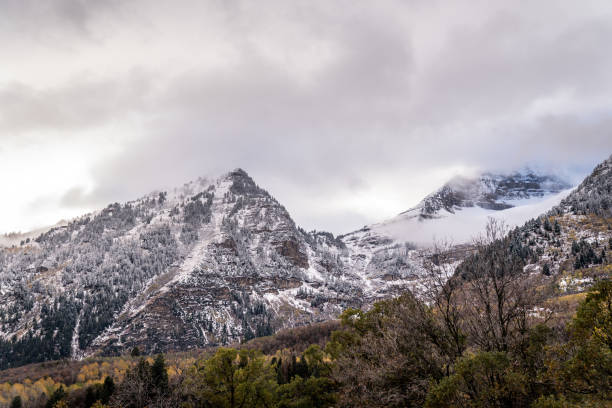 This is a view of the snow covered mountains in Provo Canyon, Utah.  This shot was taken in November after the vegetation had changed color.
