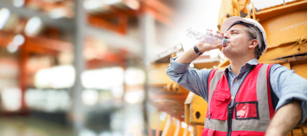 istock Thirsty and tired worker setting on the floor. 2182781436