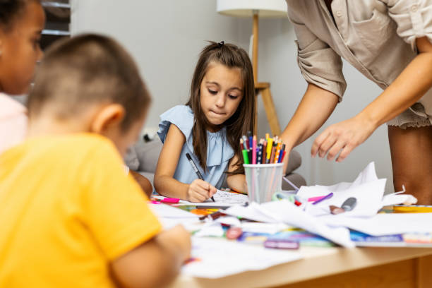 istock Children engaged in playful drawing activities at home. 2182785290