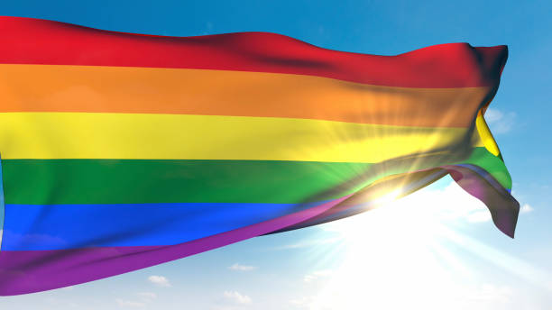 istock Rainbow Flag Waving in Sunny Sky 2182785360