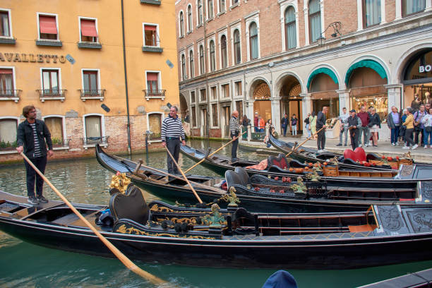 Gondola in Venice canal near Ponte della Paglia and Bridge of Sighs in St. Mark's Square in Venice, Italy