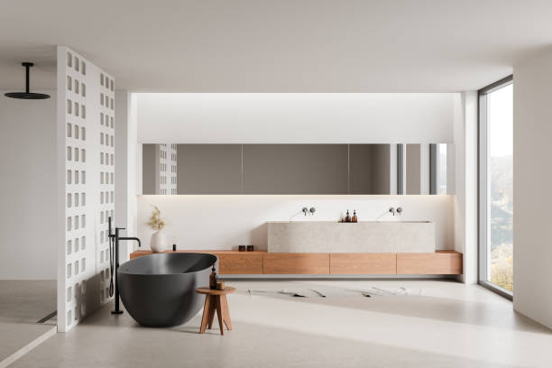 istock Modern minimalist bathroom interior with black bathtub. 3D Rendering 2182789146