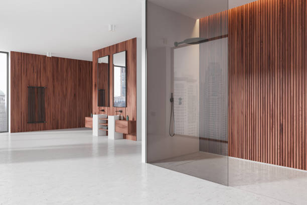 istock Home bathroom interior with double sink and glass shower, panoramic window 2182789277