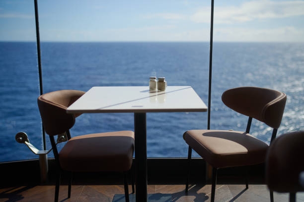 istock two chairs sitting in front of a table with two salt shakers on it 2182789701
