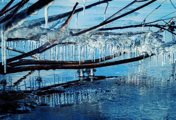 Icicle, dirty ice stalactite sharpened downward when melting dirty snow