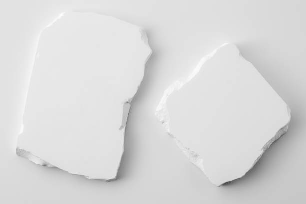 istock White cracked concrete slab on white background 2182790598
