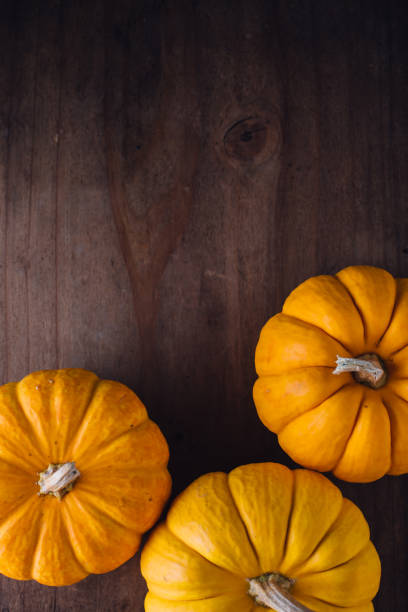 istock pumpkin on woodden background 2182790649