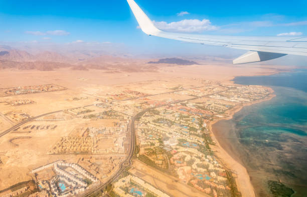View from the airplane window during takeoff in Sharm el-Sheikh, Egypt. View from the airplane to desert mountains
