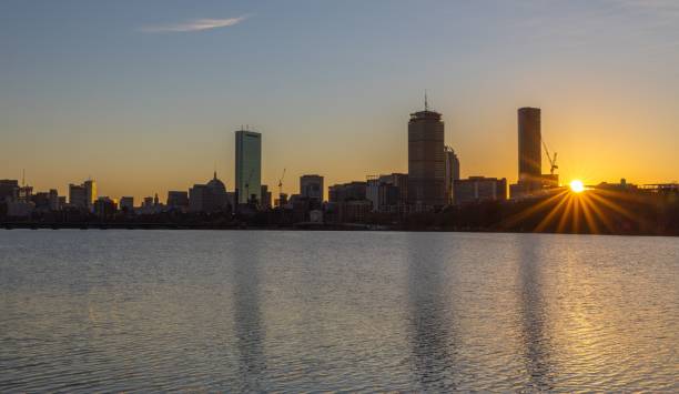 istock Boston skyline at sunset with river reflections. 2182797974