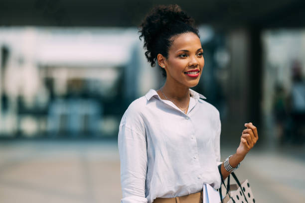 istock Confident Woman Smiling While Shopping in the City 2182797997