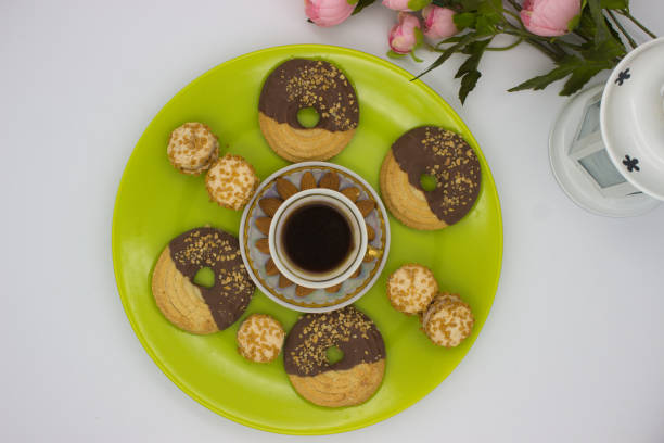 Butter cookie with coffee bean on wooden plank. coffee break. Snack and Breakfast. Selective focus. Copy space.