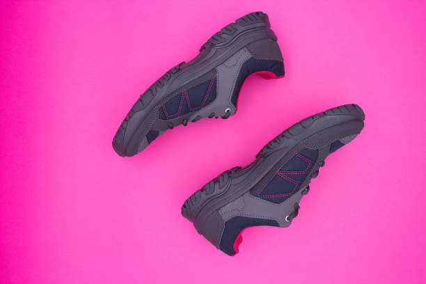 istock Stylish hiking shoes on pink background 2182799584