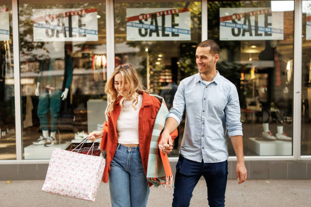 istock Young couple enjoying shopping 2182800731